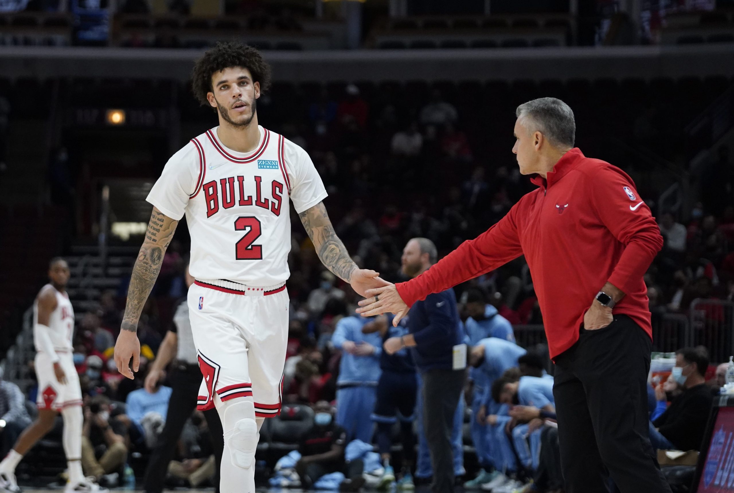 Chicago Bulls head coach Billy Donovan congratulates guard Lonzo Ball (2) during the first half at United Center