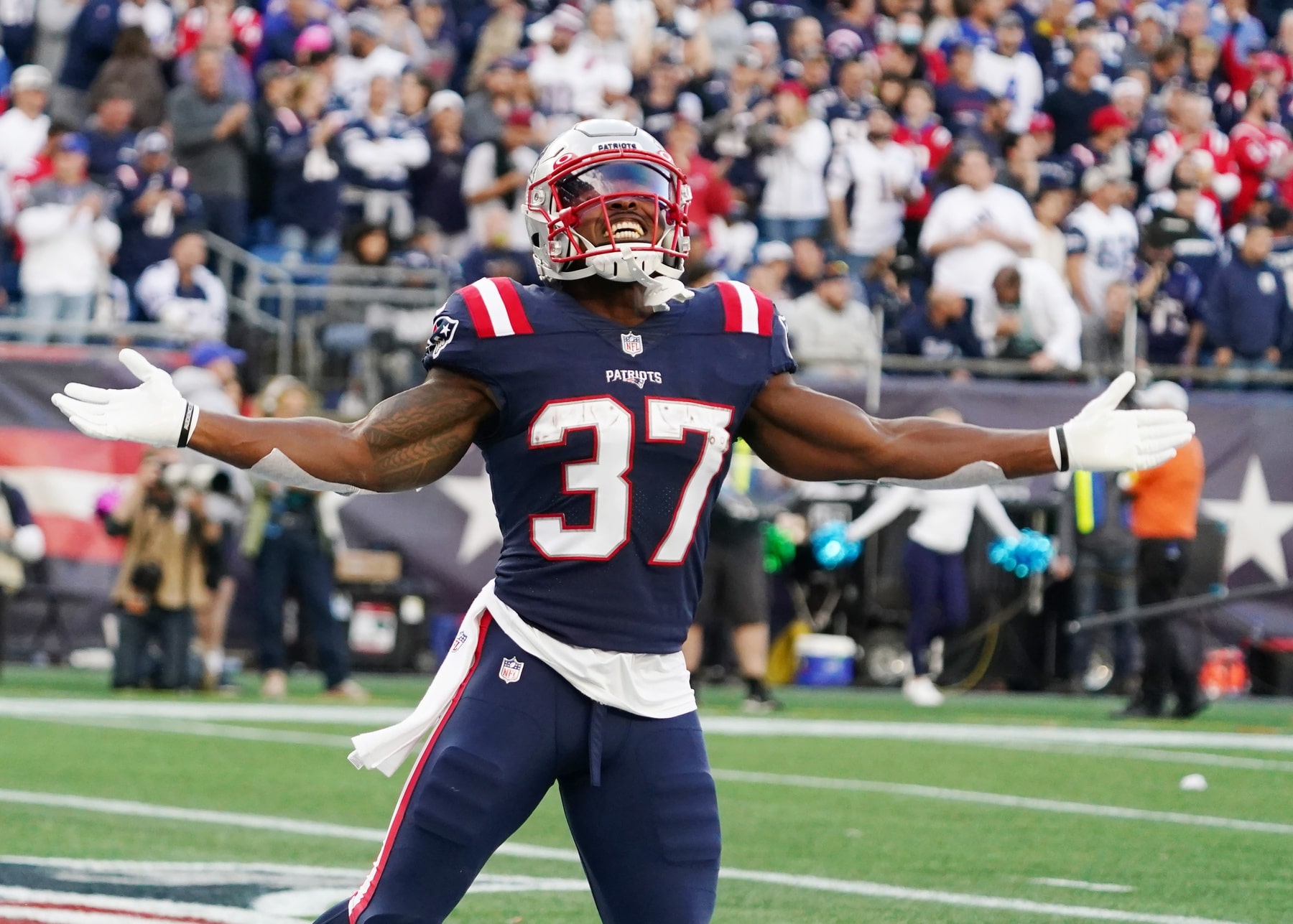 New England Patriots running back Damien Harris (37) reacts after scoring against the Dallas Cowboys in the first quarter at Gillette Stadium.