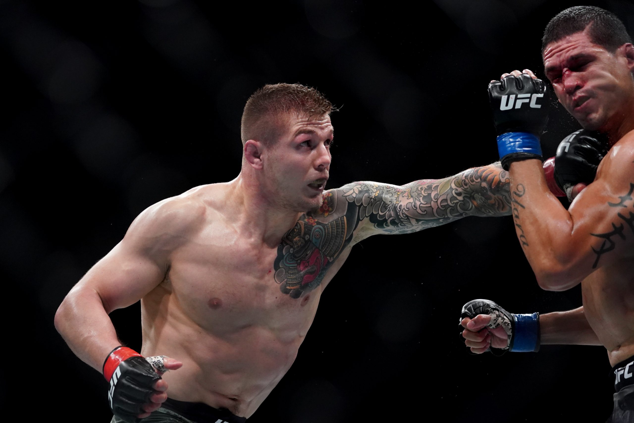 July 13, 2019; Sacramento, CA, USA; Marvin Vettori (red gloves) fights Cezar Ferreira (blue gloves) during UFC Fight Night-Sacramento at Golden 1 Center. Vettori defeated Ferreira via unanimous decision (30-27, 30-27, 30-27).