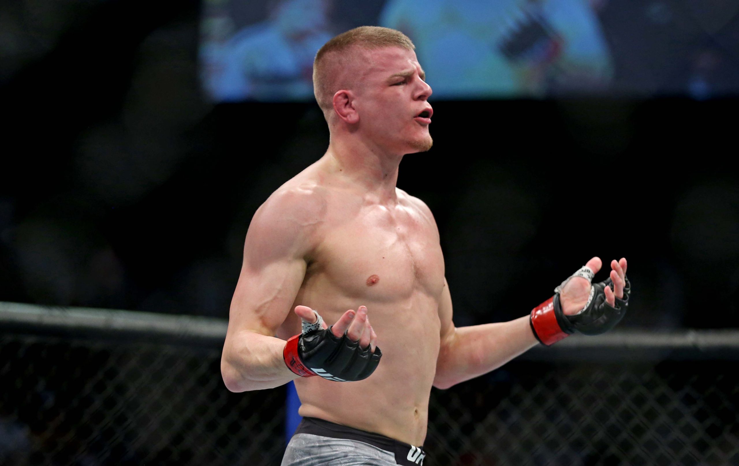 Feb 29, 2020; Norfolk, Virginia, USA; Grant Dawson (red gloves) celebrates beating Darrick Minner (blue gloves) during UFC Fight Night at Chartway Arena.