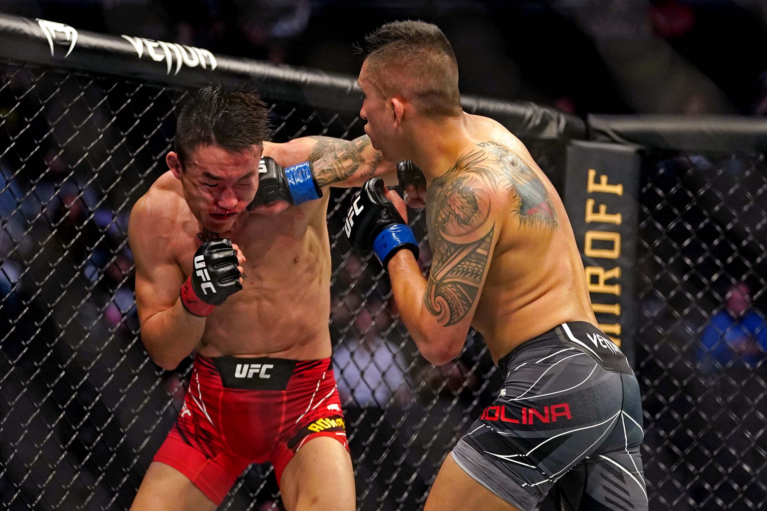 Apr 24, 2021; Jacksonville, Florida, USA; Aoriqileng (Red Gloves) fights Jeff Molina (Blue Gloves) during UFC 261 at VyStar Veterans Memorial Arena.