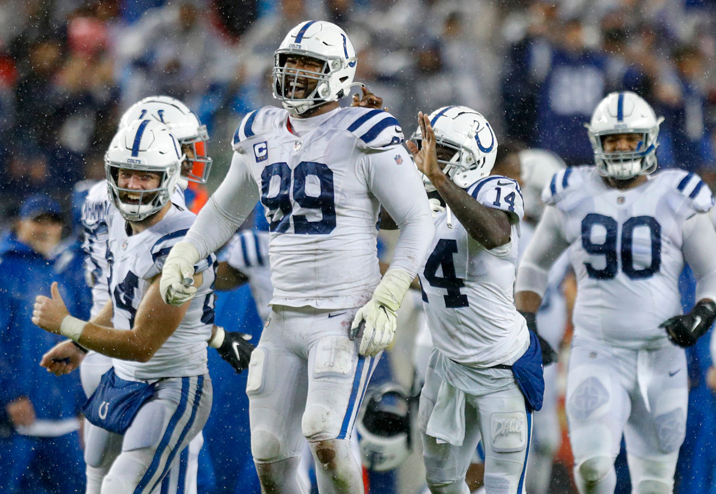 Indianapolis Colts tight end Jack Doyle (84), defensive tackle DeForest Buckner (99) and wide receiver Zach Pascal (14) celebrate after winning the game against the San Francisco 49ers, 30-18