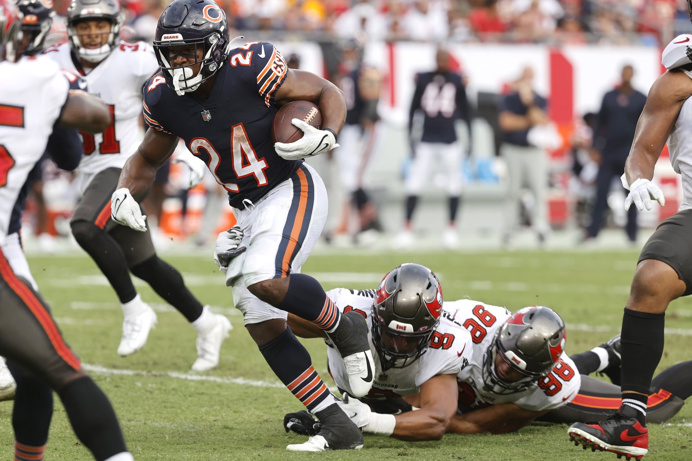 Chicago Bears running back Khalil Herbert (24) runs with the ball against the Tampa Bay Buccaneers during the first half at Raymond James Stadium