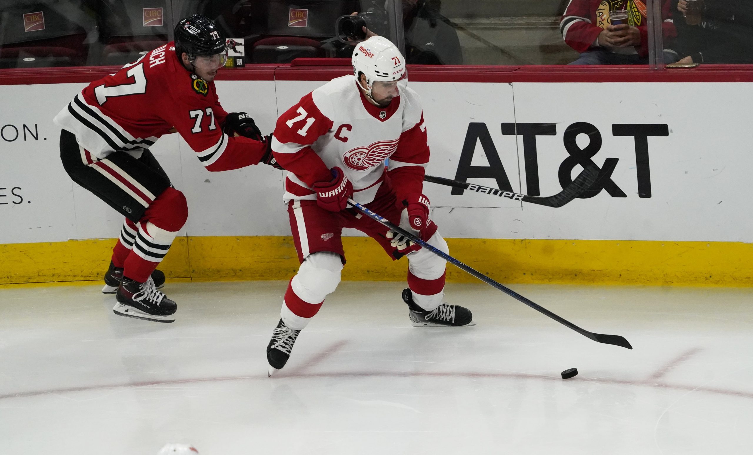 Chicago Blackhawks center Kirby Dach (77) defends Detroit Red Wings center Dylan Larkin (71) during the second period at United Center. Mandatory Credit: David Banks-USA TODAY Sports