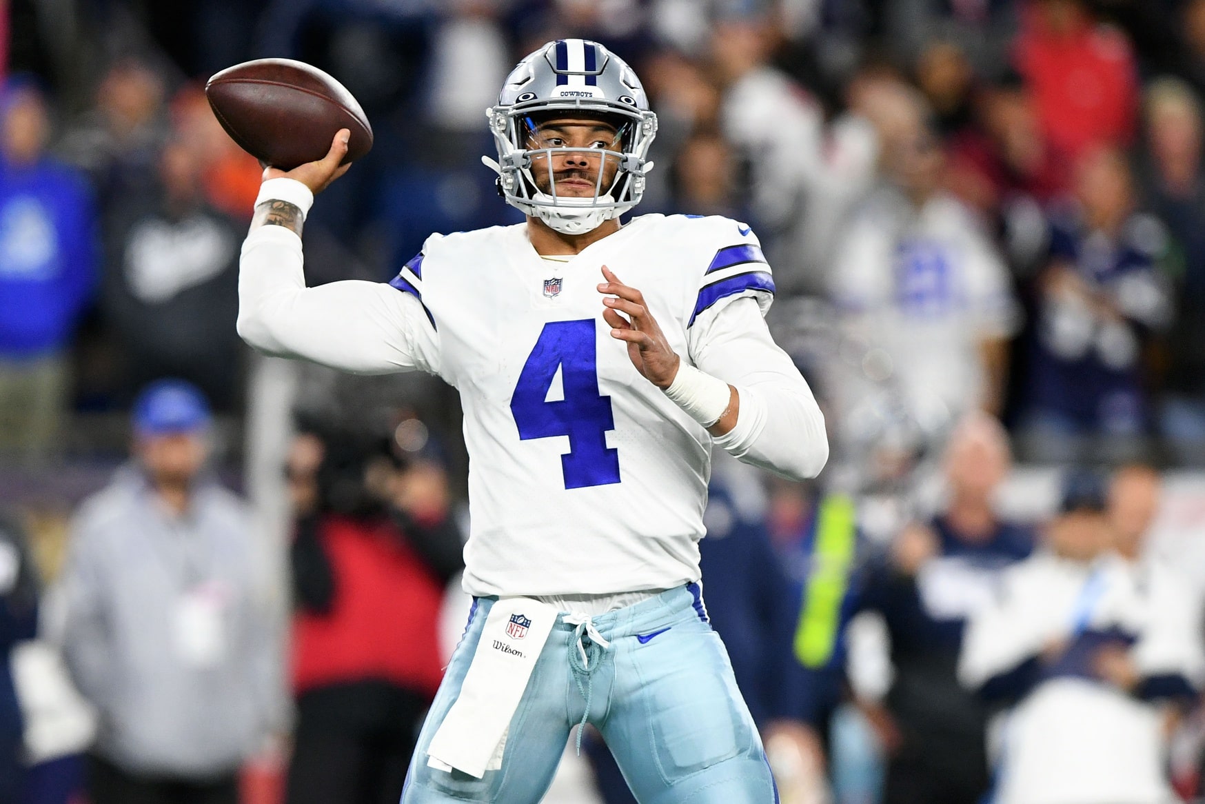 Dallas Cowboys quarterback Dak Prescott (4) passes the ball against the New England Patriots during the second half at Gillette Stadium.