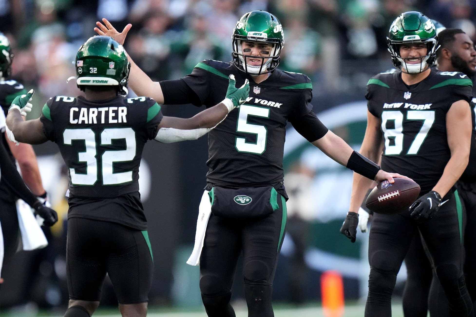 New York Jets quarterback Mike White (5) celebrates the victory with New York Jets running back Michael Carter (32) at the conclusion of a Week 8 NFL football game against the Cincinnati Bengals.