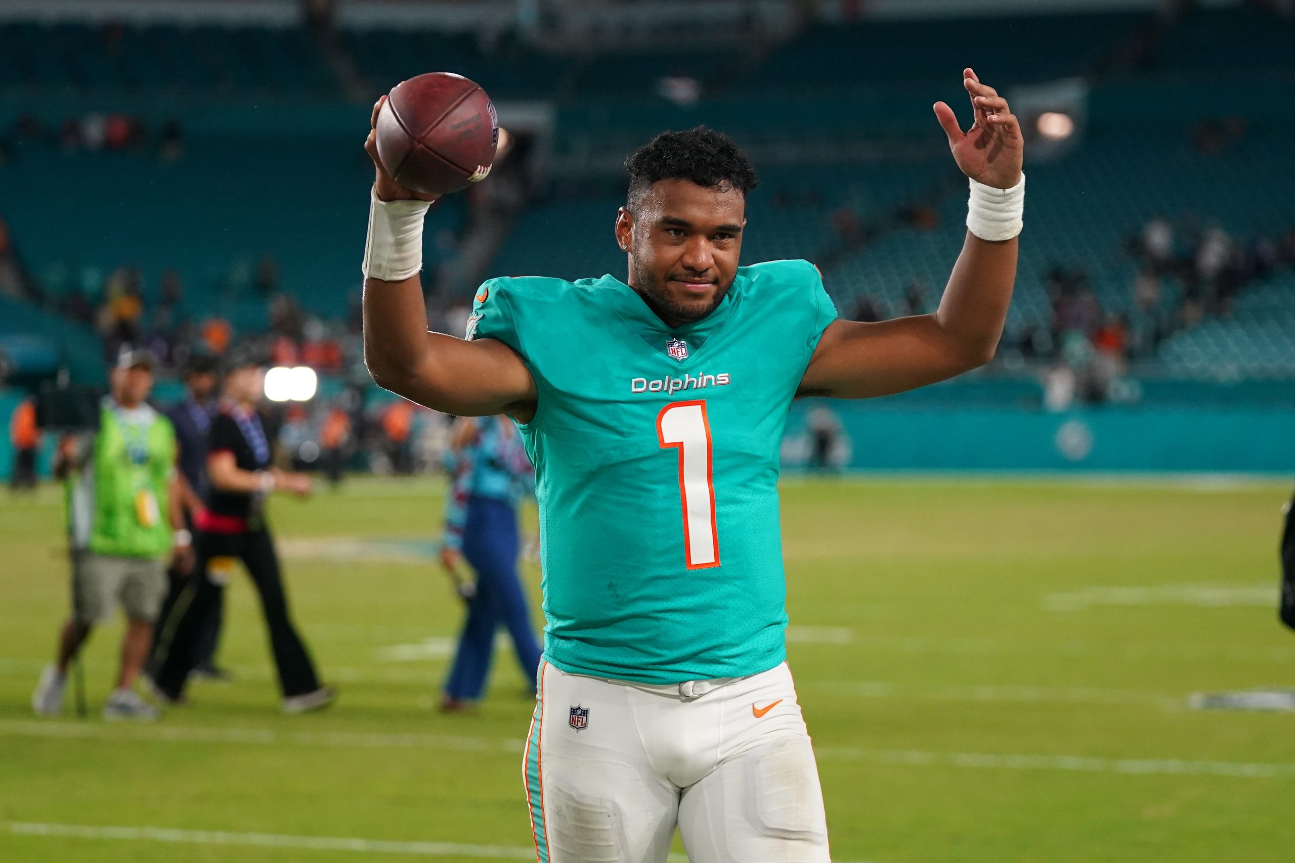 Miami Dolphins quarterback Tua Tagovailoa (1) celebrates after defeating the Baltimore Ravens at Hard Rock Stadium