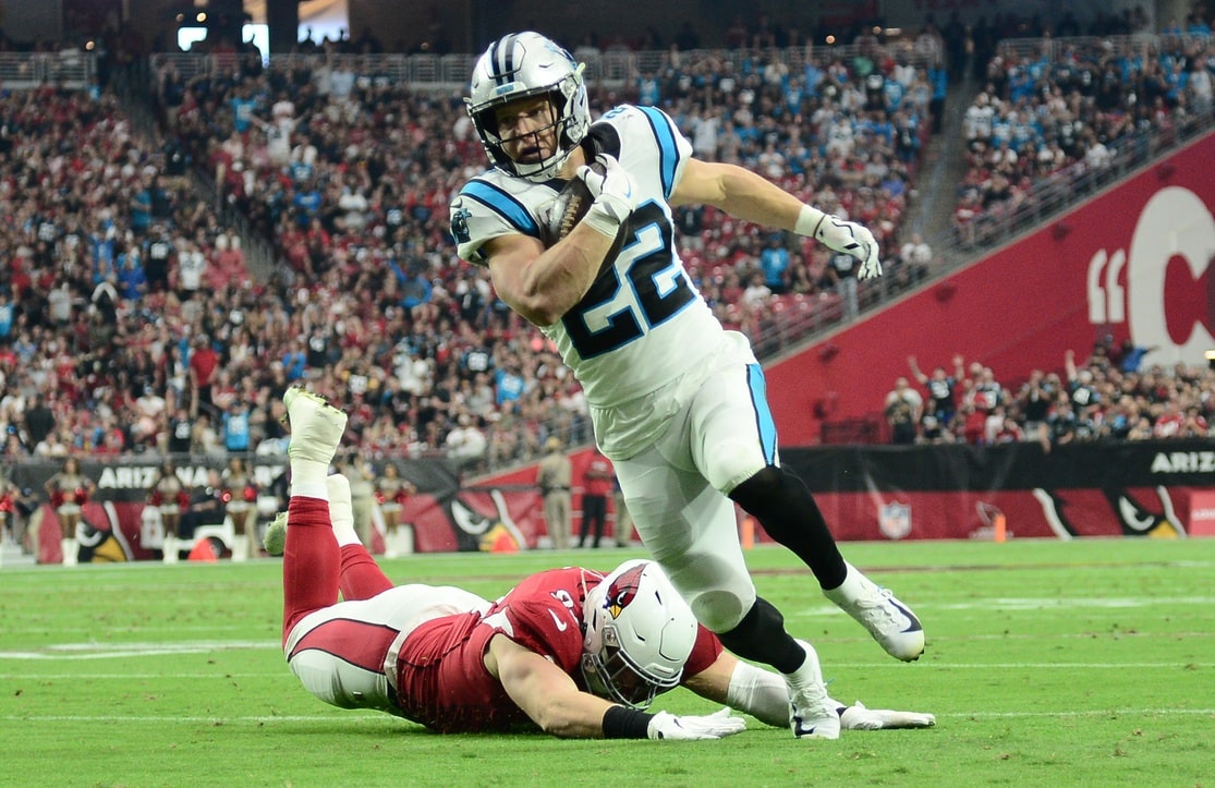 Carolina Panthers running back Christian McCaffrey (22) runs against the Arizona Cardinals during the first half at State Farm Stadium.