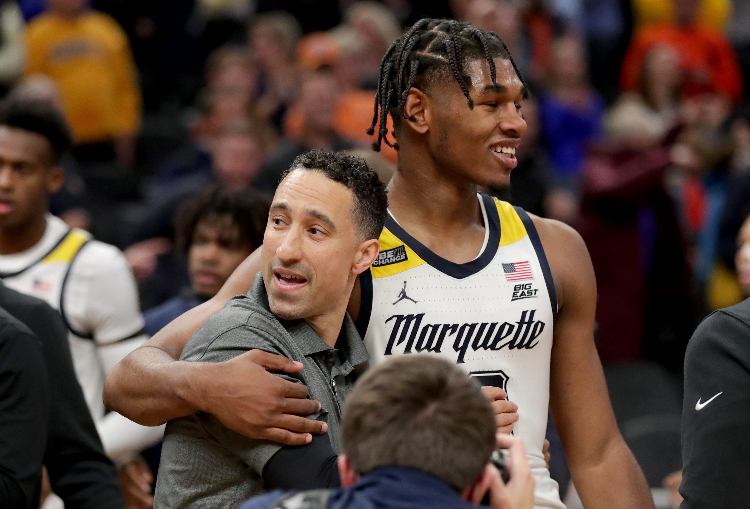 Smart celebrates with Marquette Golden Eagles forward Justin Lewis