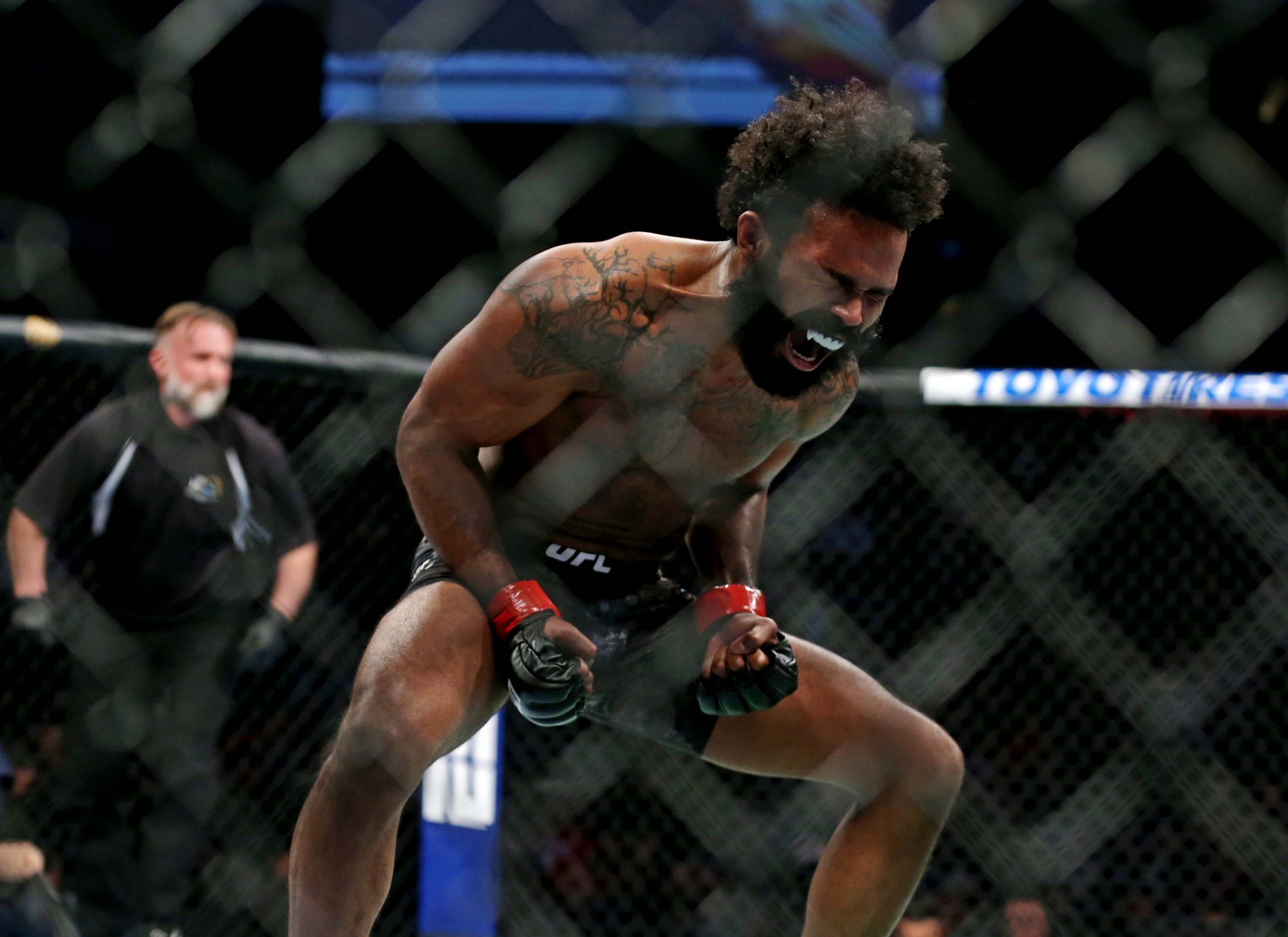 Feb 29, 2020; Norfolk, Virginia, USA; Sean Brady (red gloves) celebrates beating Ismail Naurdiev (blue gloves) during UFC Fight Night at Chartway Arena.