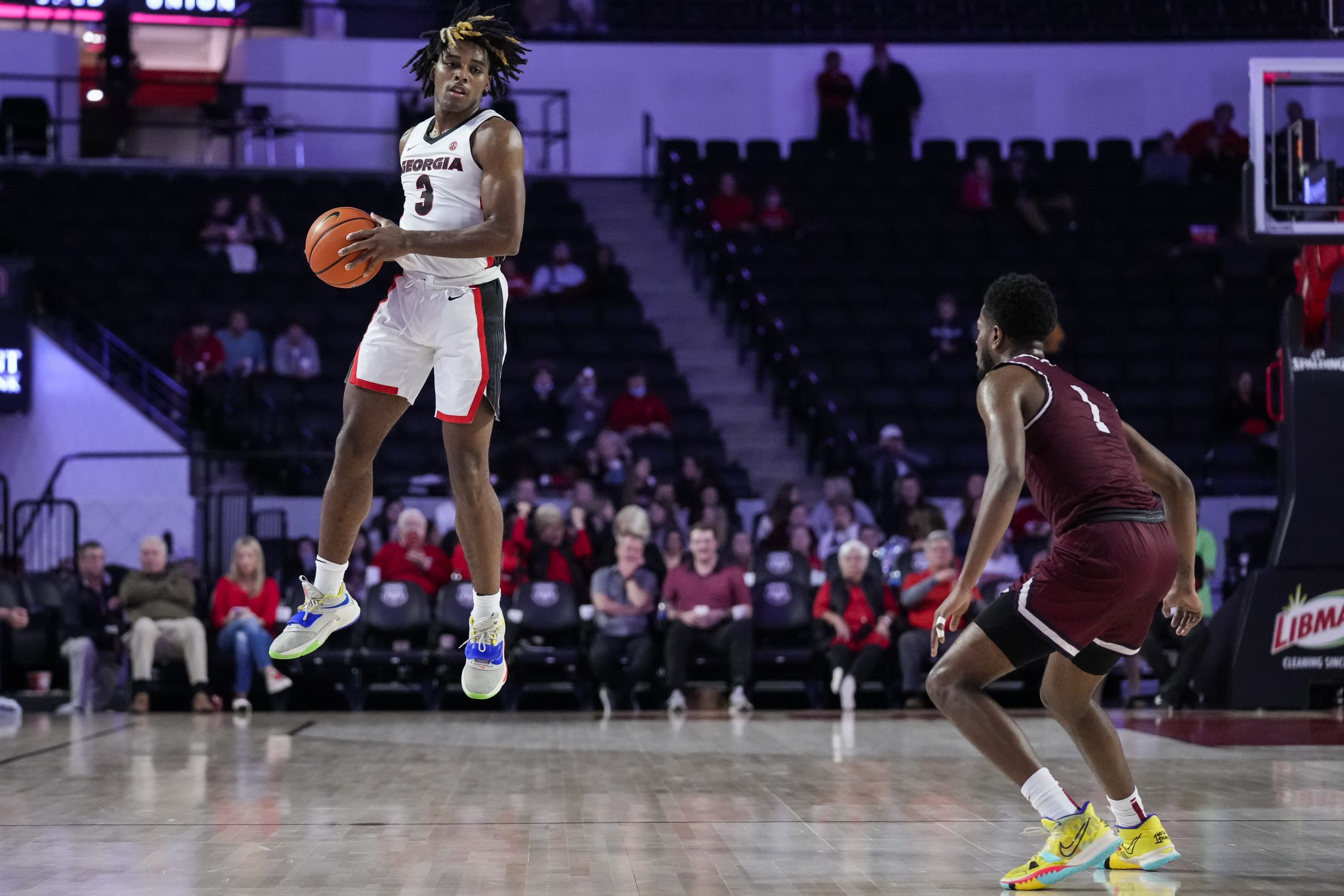 Georgia Bulldogs guard Kario Oquendo (3) goes up to control a pass in front of South Carolina State Bulldogs guard Cam Jones (1) during the second half at Stegeman Coliseum