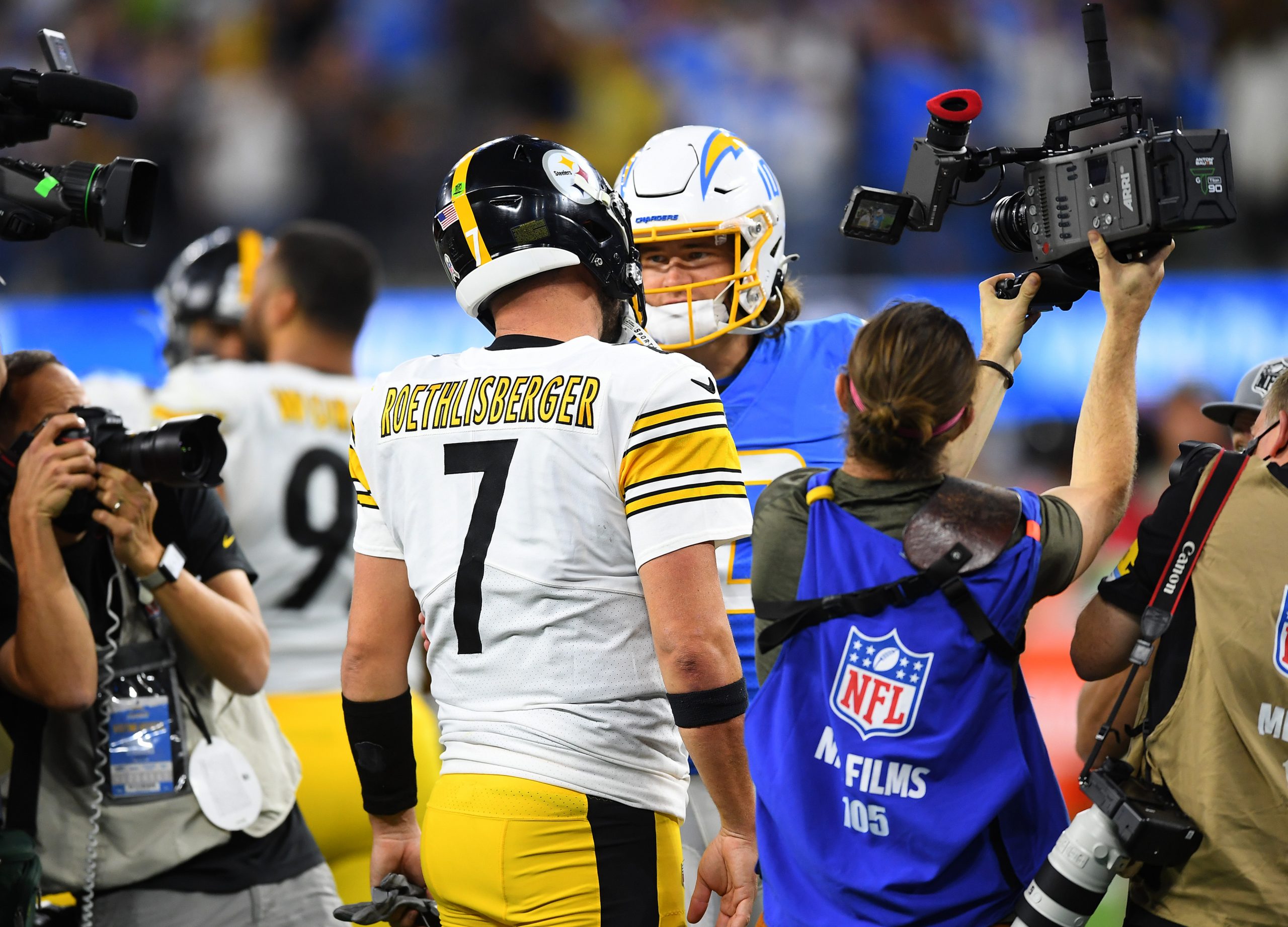 Pittsburgh Steelers quarterback Ben Roethlisberger (7) talks with Los Angeles Chargers quarterback Justin Herbert (10) after the game at SoFi Stadium