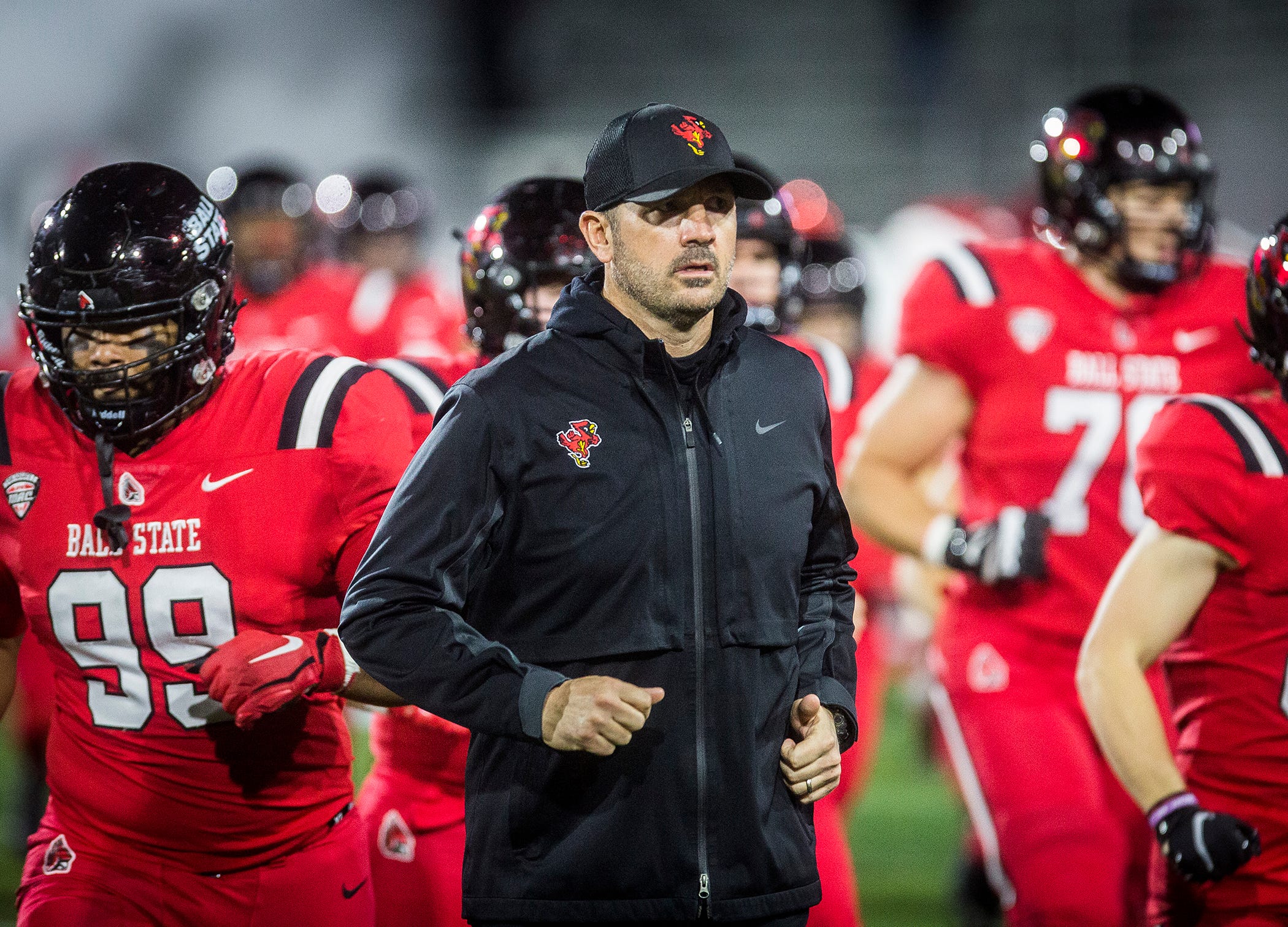 Ball State head coach Mike Neu runs onto the field prior to Ball State's game against Central Michigan at Scheumann Stadium Wednesday, Nov. 17, 2021
