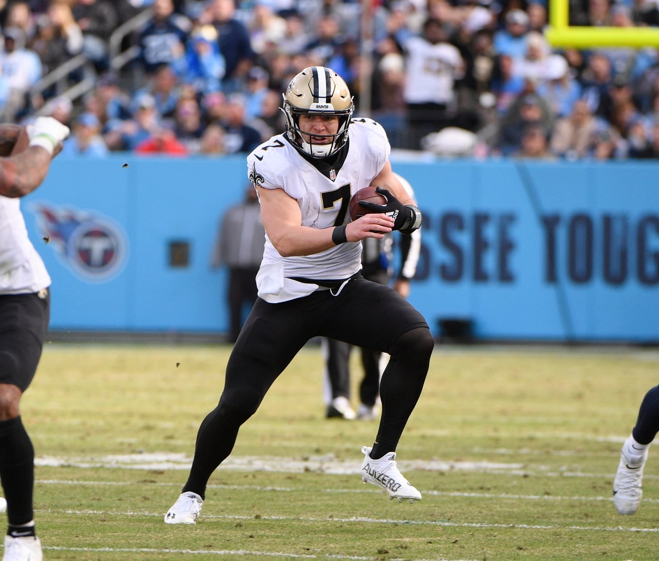 New Orleans Saints quarterback Taysom Hill (7) runs the ball against the Tennessee Titans during the second half at Nissan Stadium.