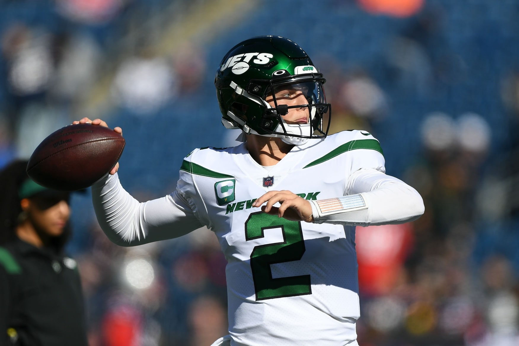 New York Jets quarterback Zach Wilson (2) throws a ball before the start of a game against the New England Patriots at Gillette Stadium.