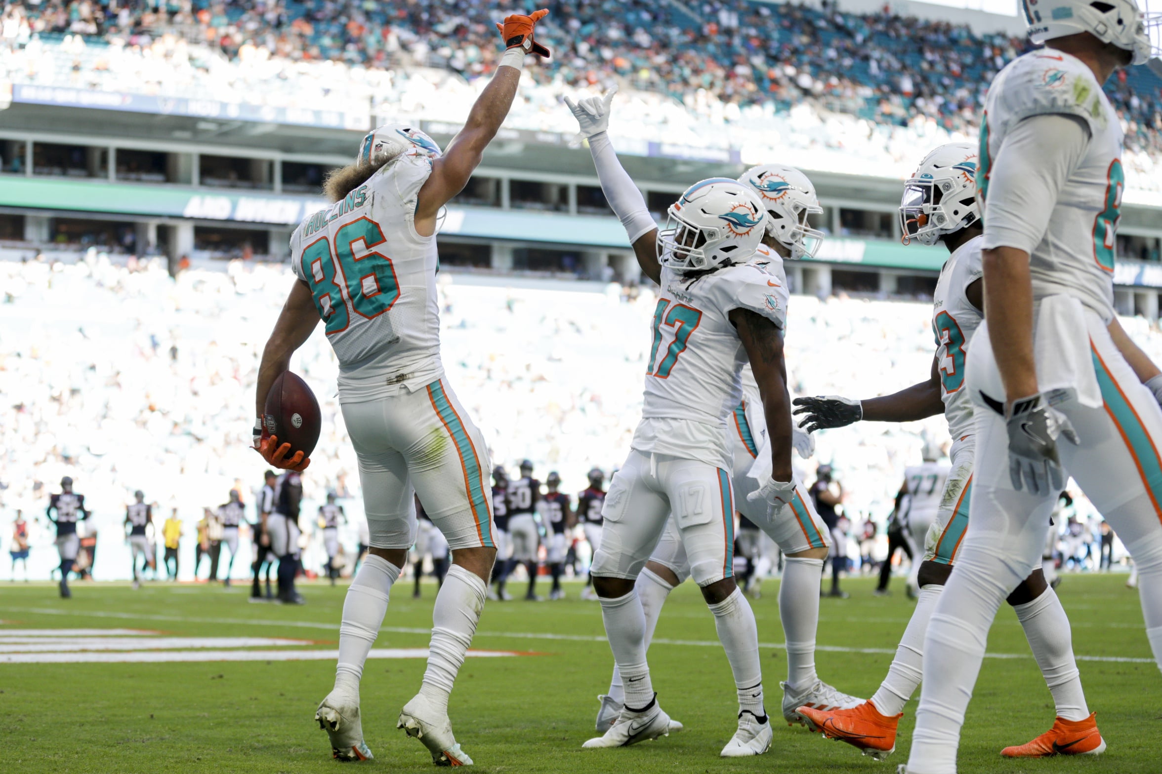 Miami Dolphins wide receiver Mack Hollins (86) celebrates with wide receiver Jaylen Waddle (17) after scoring a touchdown against the Houston Texans during gate second quarter of the game at Hard Rock Stadium.