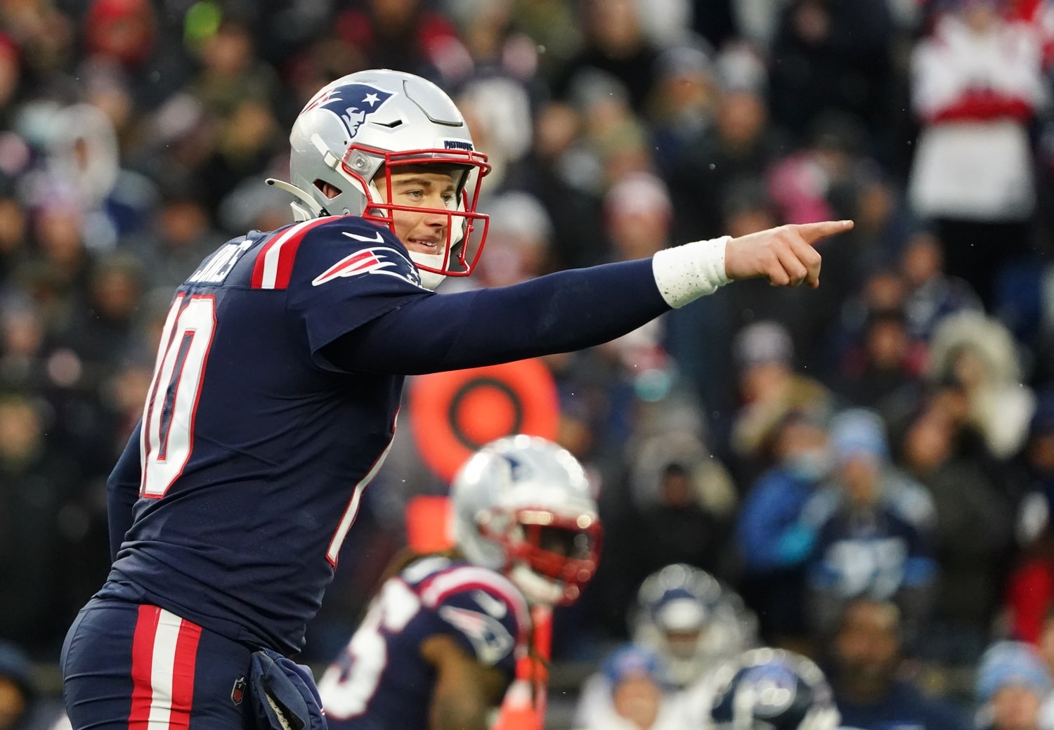 New England Patriots quarterback Mac Jones (10) on the line of scrimmage against the Tennessee Titans in the second half at Gillette Stadium.