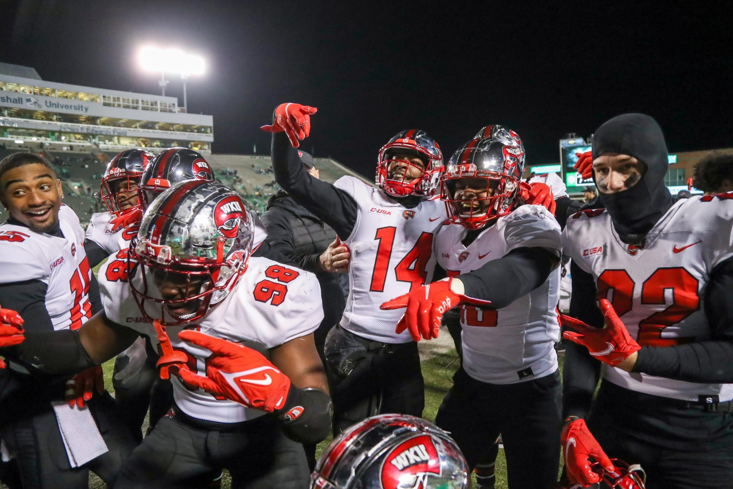 Western Kentucky Hilltoppers defensive back Davion Williams (14) celebrates with teammates after an interception for a touchdown during the fourth quarter against the Marshall Thundering Herd.