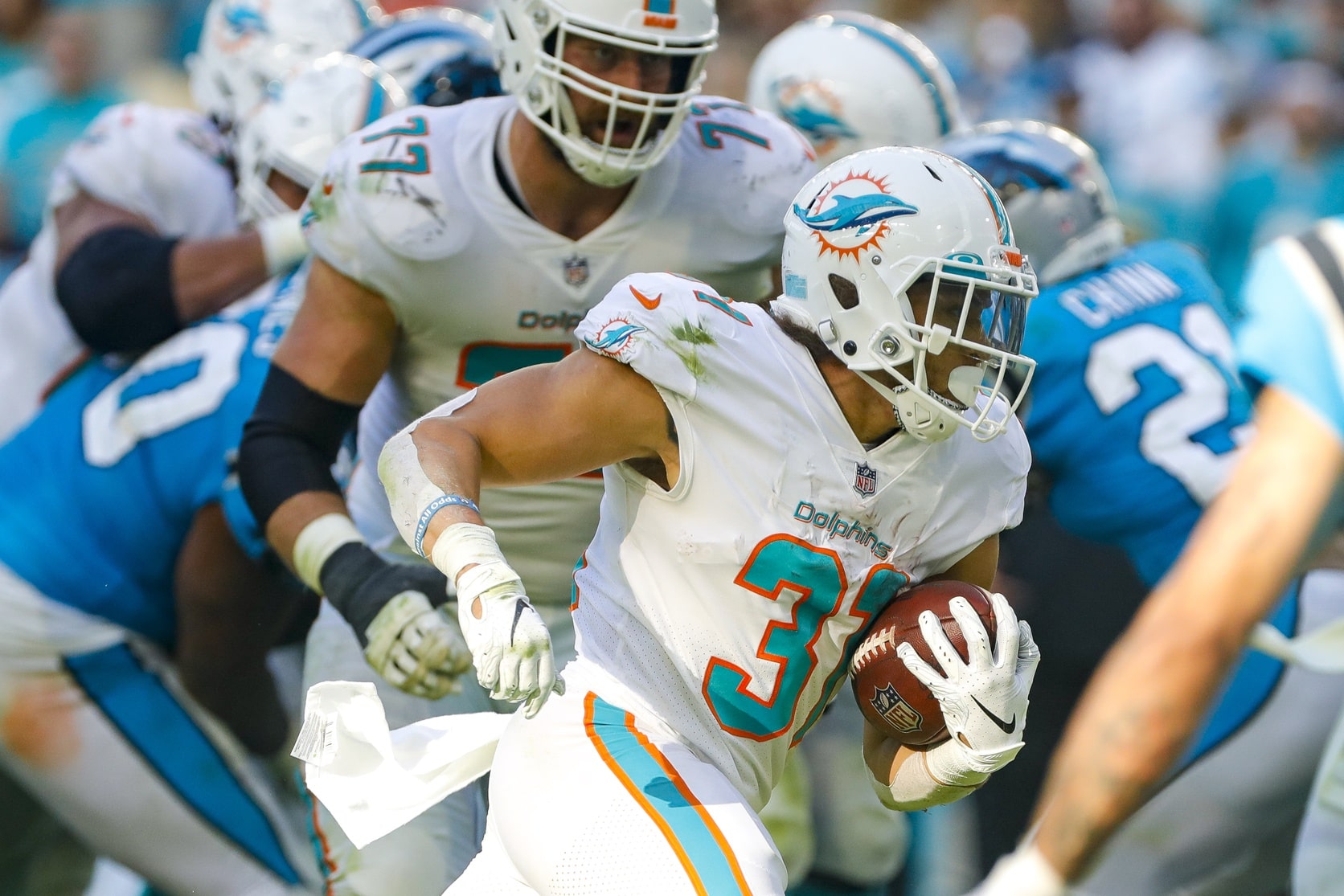Miami Dolphins running back Phillip Lindsay (31) runs with the football against the Carolina Panthers during the fourth quarter at Hard Rock Stadium.