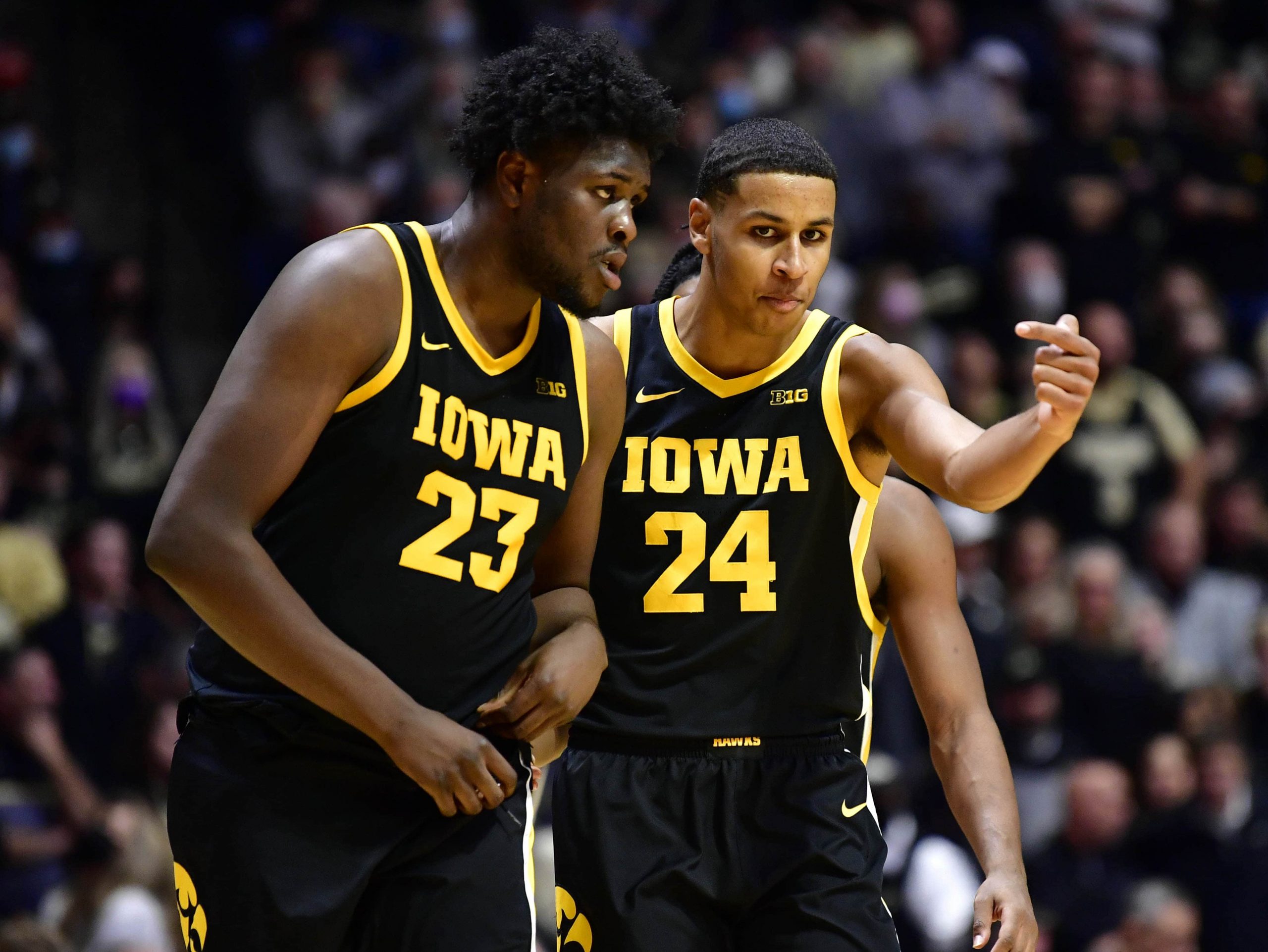 Iowa Hawkeyes forward Josh Ogundele (23) and Iowa Hawkeyes forward Kris Murray