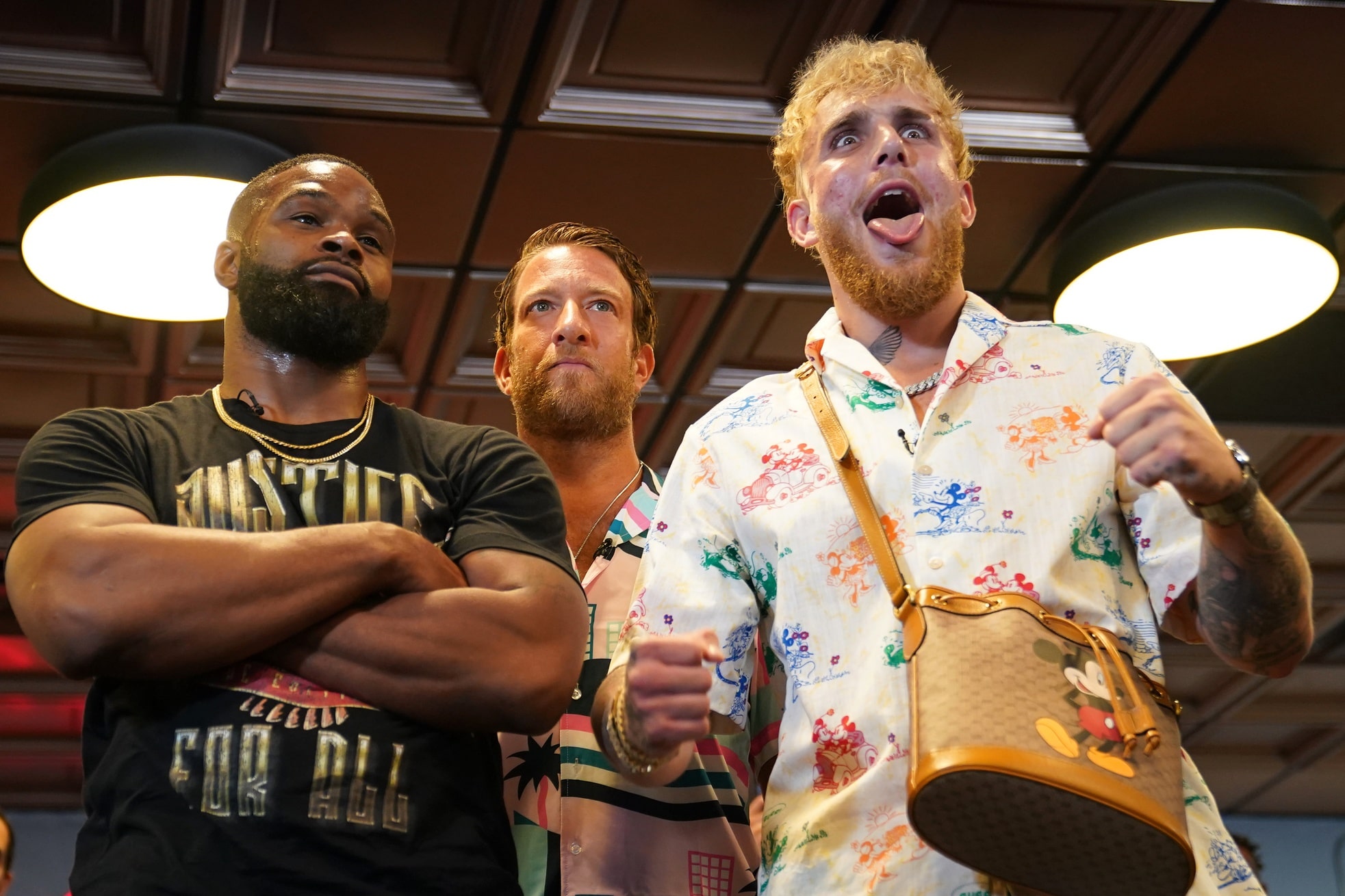 Professional MMA fighter Tyron Woodley and YouTube star Jake Paul face off in front of Barstool Sports founder Dave Portnoy at World Famous 5th St. Gym.