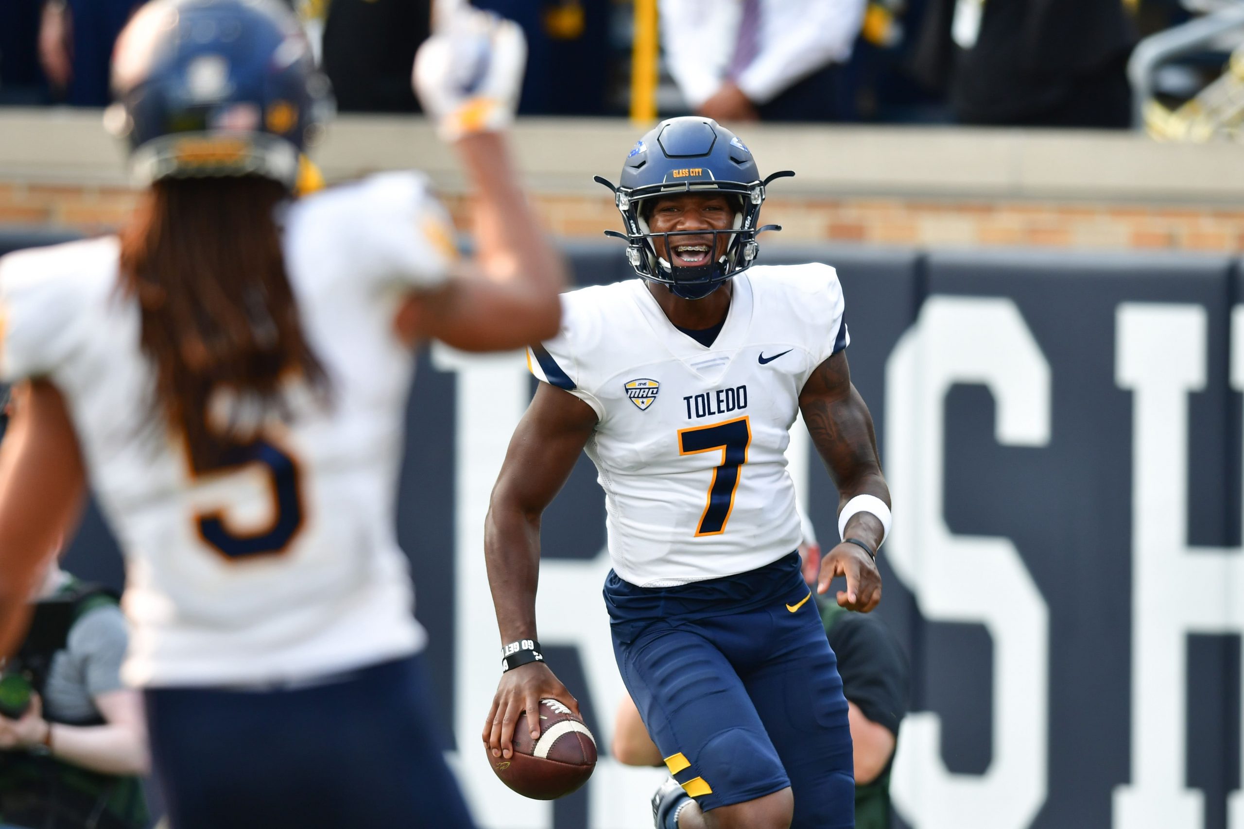 Toledo Rockets quarterback Dequan Finn (7) celebrates after a touchdown in the fourth quarter against the Notre Dame Fighting Irish at Notre Dame Stadium. Mandatory Credit: Matt Cashore-USA TODAY Sports