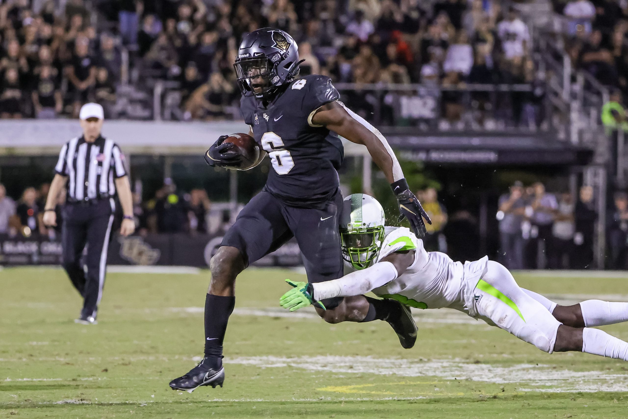 UCF Knights running back Mark-Antony Richards (6) is tackled by South Florida Bulls safety Vincent Davis (3) during the second half at Bounce House. Mandatory Credit: Mike Watters-USA TODAY Sports