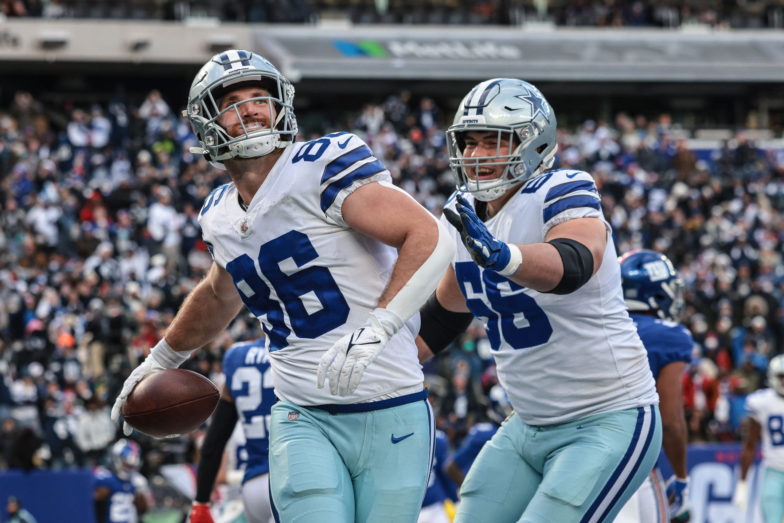 Dallas Cowboys tight end Dalton Schultz (86) celebrates his touchdown reception with guard Connor McGovern (66) during the second half against the New York Giants at MetLife Stadium.