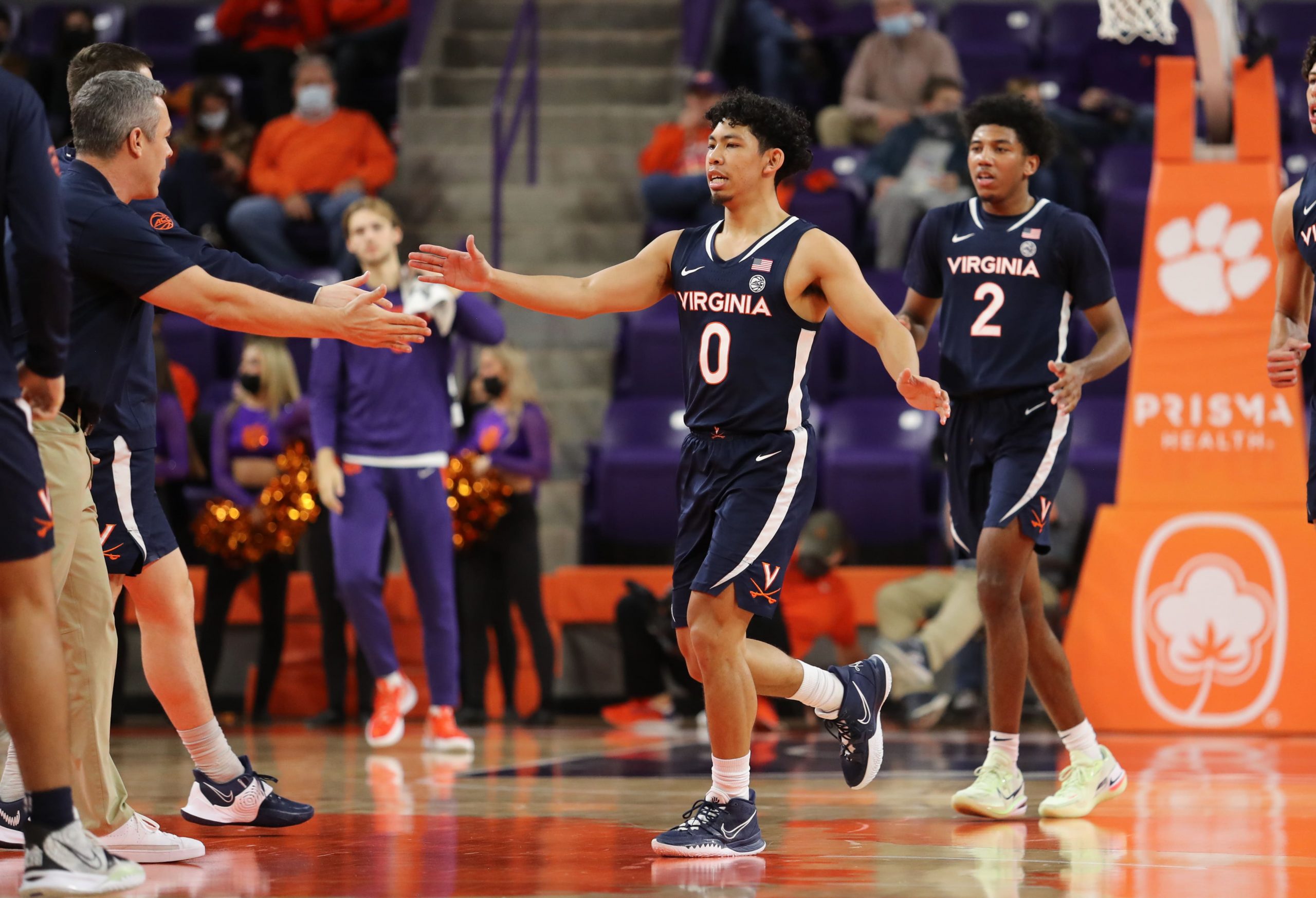 Virginia Cavaliers guard Kihei Clark (0) greets head coach Tony Bennett during a timeout in the second half against the Clemson Tigers at Littlejohn Coliseum