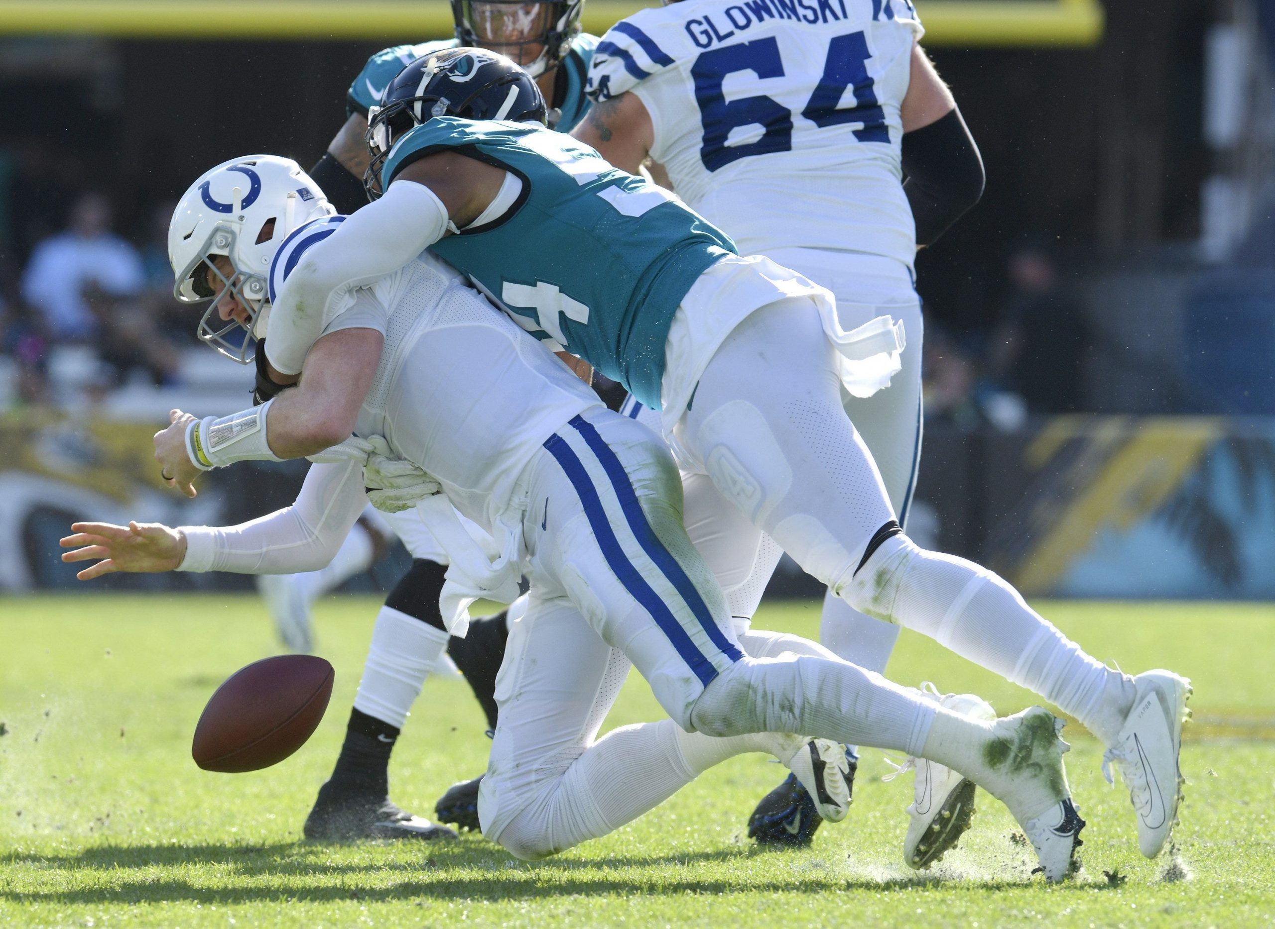 Jacksonville Jaguars middle linebacker Damien Wilson (54) forces a fumble during a sack on Indianapolis Colts quarterback Carson Wentz (2) which the Jaguars recovered during early third quarter action