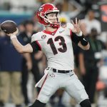 Georgia quarterback Stetson Bennett passes against Michigan during the first half of the Orange Bowl NCAA College Football Playoff semifinal game, Friday, Dec. 31, 2021, in Miami Gardens, Fla.