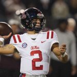 Mississippi quarterback Matt Corral (2) passes against Mississippi State during the first half of an NCAA college football game, Thursday, Nov. 25, 2021, in Starkville, Miss. The Southeastern Conference's most prolific offense clashes with one of the better defenses in the Big 12 when No. 8 Mississippi meets sixth-ranked Baylor in the Sugar Bowl