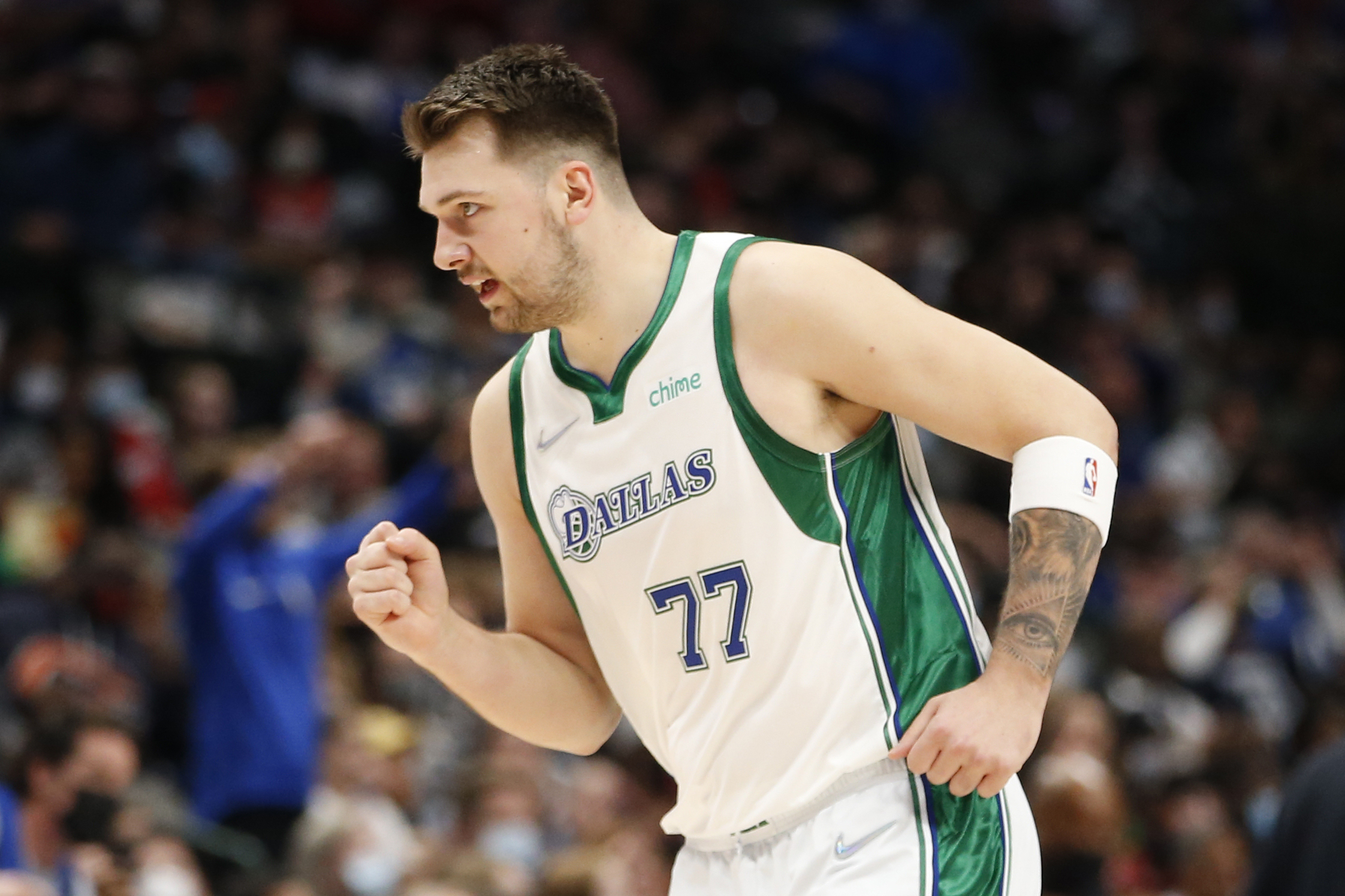 Dallas Mavericks guard Luka Doncic (77) reacts after a basket against the Chicago Bulls in the first half of an NBA basketball game in Dallas, Sunday, Jan. 9, 2022.