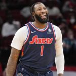 Philadelphia 76ers center Andre Drummond reacts after his dunk during the first half of an NBA basketball game against the Houston Rockets, Monday, Jan. 10, 2022, in Houston.
