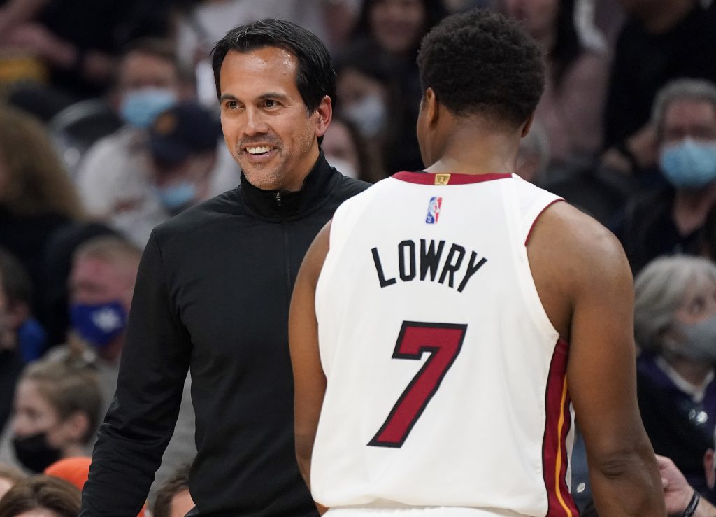 Miami Heat coach Erik Spoelstra smiles next to guard Kyle Lowry (7) as the Heat led the Phoenix Suns during the second half of an NBA basketball game Saturday, Jan. 8, 2022, in Phoenix