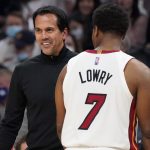 Miami Heat coach Erik Spoelstra smiles next to guard Kyle Lowry (7) as the Heat led the Phoenix Suns during the second half of an NBA basketball game Saturday, Jan. 8, 2022, in Phoenix