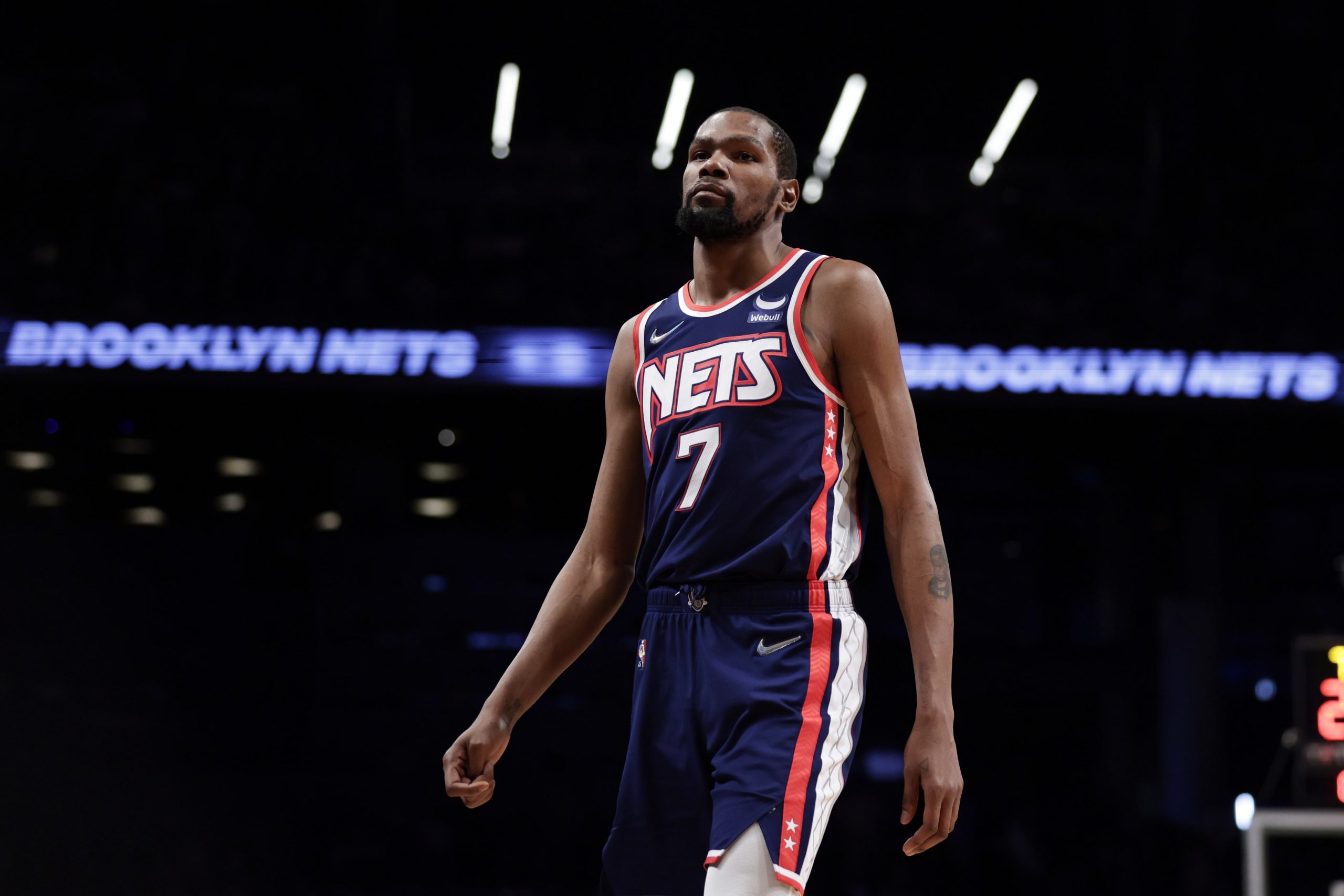 Brooklyn Nets forward Kevin Durant (7) walks on the court against the Milwaukee Bucks during the first half of an NBA basketball game Friday, Jan. 7, 2022, in New York