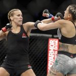 Katlyn Chookagian, left, punches Brazil's Jennifer Maia during the first round of a women's flyweight mixed martial arts bout at UFC 244, Saturday, Nov. 2, 2019, in New York. Chookagian won the fight.