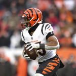 Cincinnati Bengals running back Chris Evans (25) carries the ball in the second half of an NFL football game, Sunday, Jan. 9, 2022, in Cleveland.