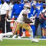 San Francisco 49ers wide receiver Brandon Aiyuk (11) runs with the ball during an NFL football game against the Los Angeles Rams Sunday, Jan. 9, 2022, in Inglewood, Calif.