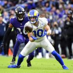 FILE - Los Angeles Rams wide receiver Cooper Kupp (10) attempts to catch the ball against Baltimore Ravens safety Chuck Clark (36) during the first half of an NFL football game, on Jan. 2, 2022, in Baltimore. Five players, including dynamic pass catchers Cooper Kupp and Davante Adams, are unanimous choices for The Associated Press 2021 NFL All-Pro Team, announced Friday, Jan. 14, 2022.