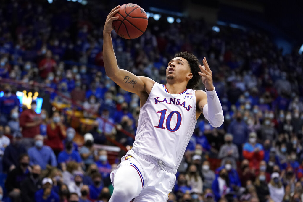 Kansas forward Jalen Wilson lays the ball up against West Virginia in the first half of an NCAA college basketball game Saturday, Jan. 15, 2022, in Lawrence, Kan.