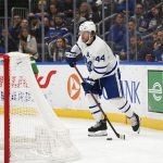 Toronto Maple Leafs defenseman Morgan Rielly (44) controls the puck behind the net during the second period of an NHL hockey game against the St. Louis Blues on Saturday, Jan. 15, 2022, in St. Louis.