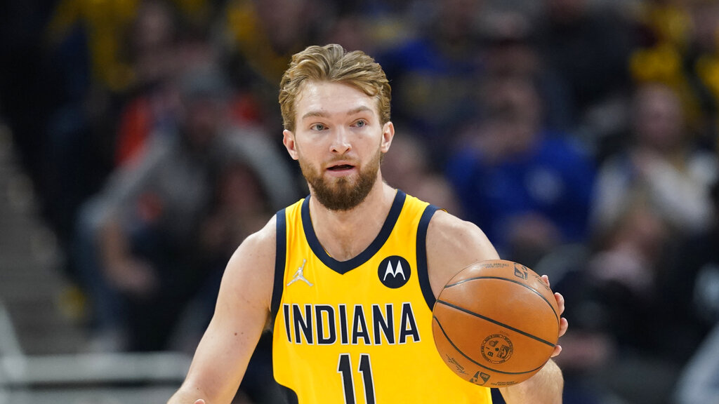 Indiana Pacers' Domantas Sabonis (11) dribbles during the first half of an NBA basketball game against the Phoenix Suns, Friday, Jan. 14, 2022, in Indianapolis.