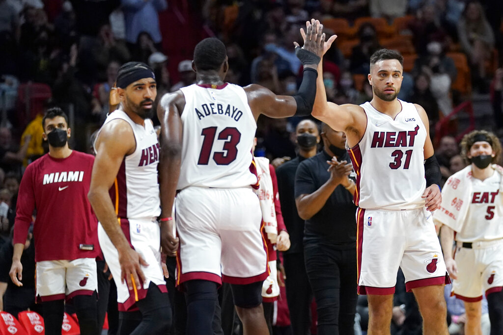 Miami Heat guard Max Strus (31) greets center Bam Adebayo (13) during the second half of an NBA basketball game against the Portland Trail Blazers, Wednesday, Jan. 19, 2022, in Miami. The Heat won 104-92.