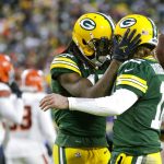 FILE - Green Bay Packers' Davante Adams, left, celebrates his touchdown reception with Aaron Rodgers during the first half of an NFL football game against the Cleveland Browns Saturday, Dec. 25, 2021, in Green Bay, Wis. Until this season, Green Bay Packers quarterback Aaron Rodgers always referred to Hall of Fame cornerback Charles Woodson as his greatest teammate ever. After a Christmas Day victory over the Cleveland Browns, Rodgers called Adams the “most dominant player I’ve played with.”