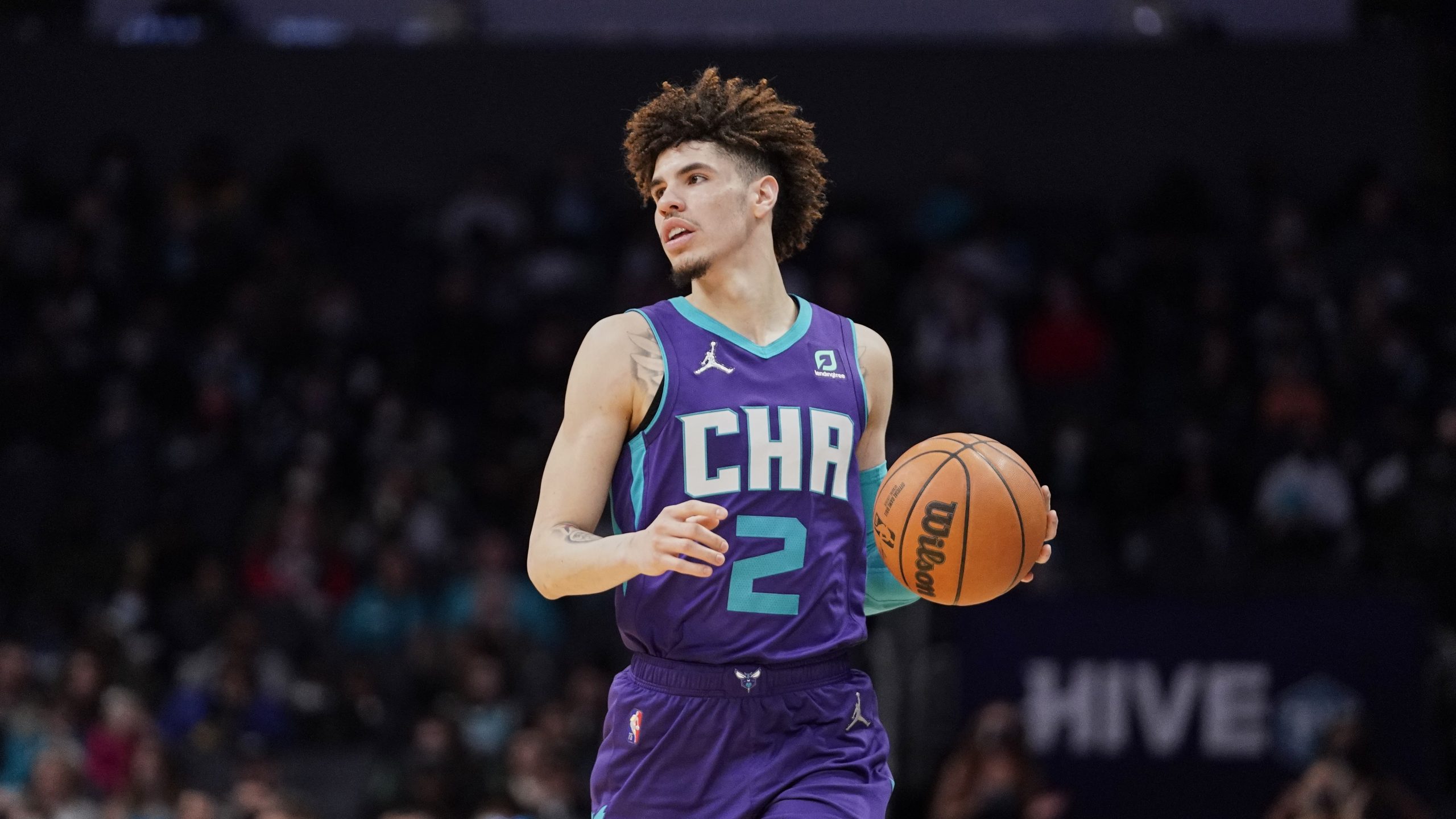 Charlotte Hornets guard LaMelo Ball (2) brings the ball upcourt during an NBA basketball game against the Los Angeles Clippers Sunday, Jan. 30, 2022, in Charlotte, N.C.