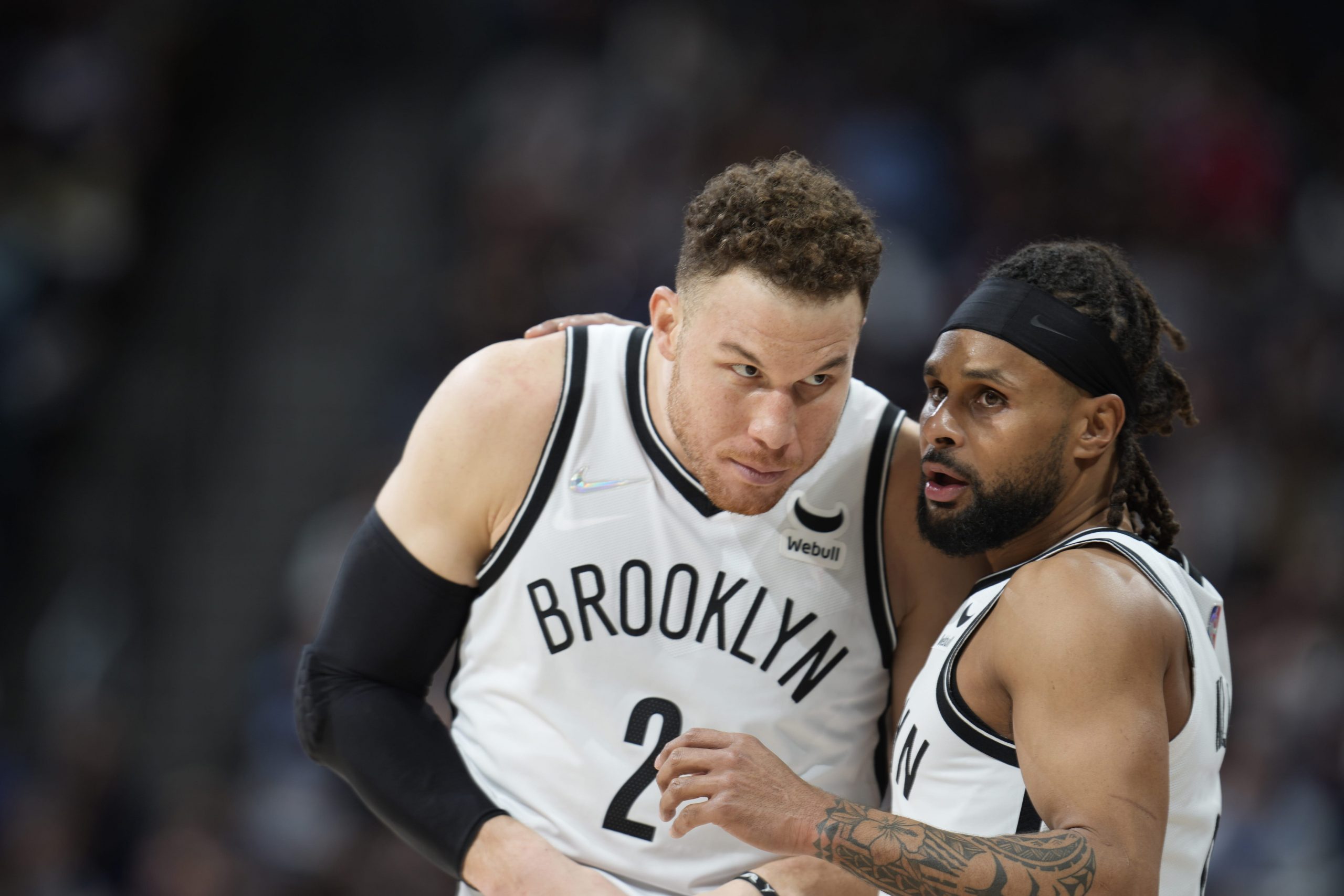 Patty Mills and Blake Griffin of the Brooklyn Nets