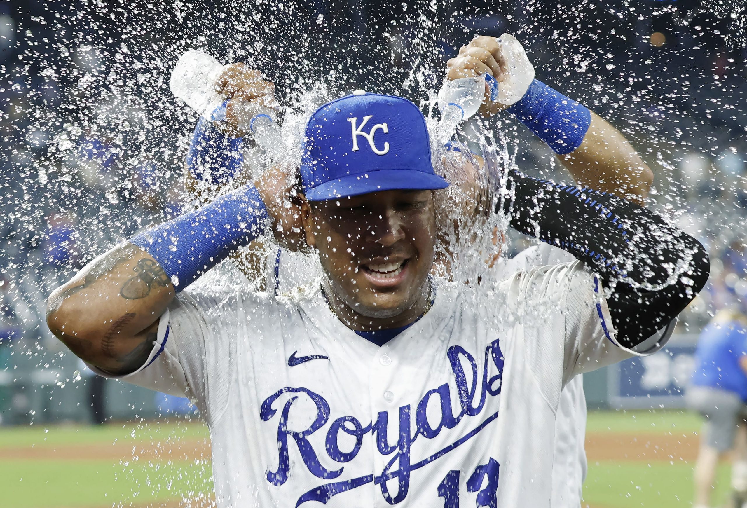 Kansas City Royals' Salvador Perez is doused with water following the team's 8-4 win over the New York Yankees in a baseball game at Kauffman Stadium in Kansas City, Mo.