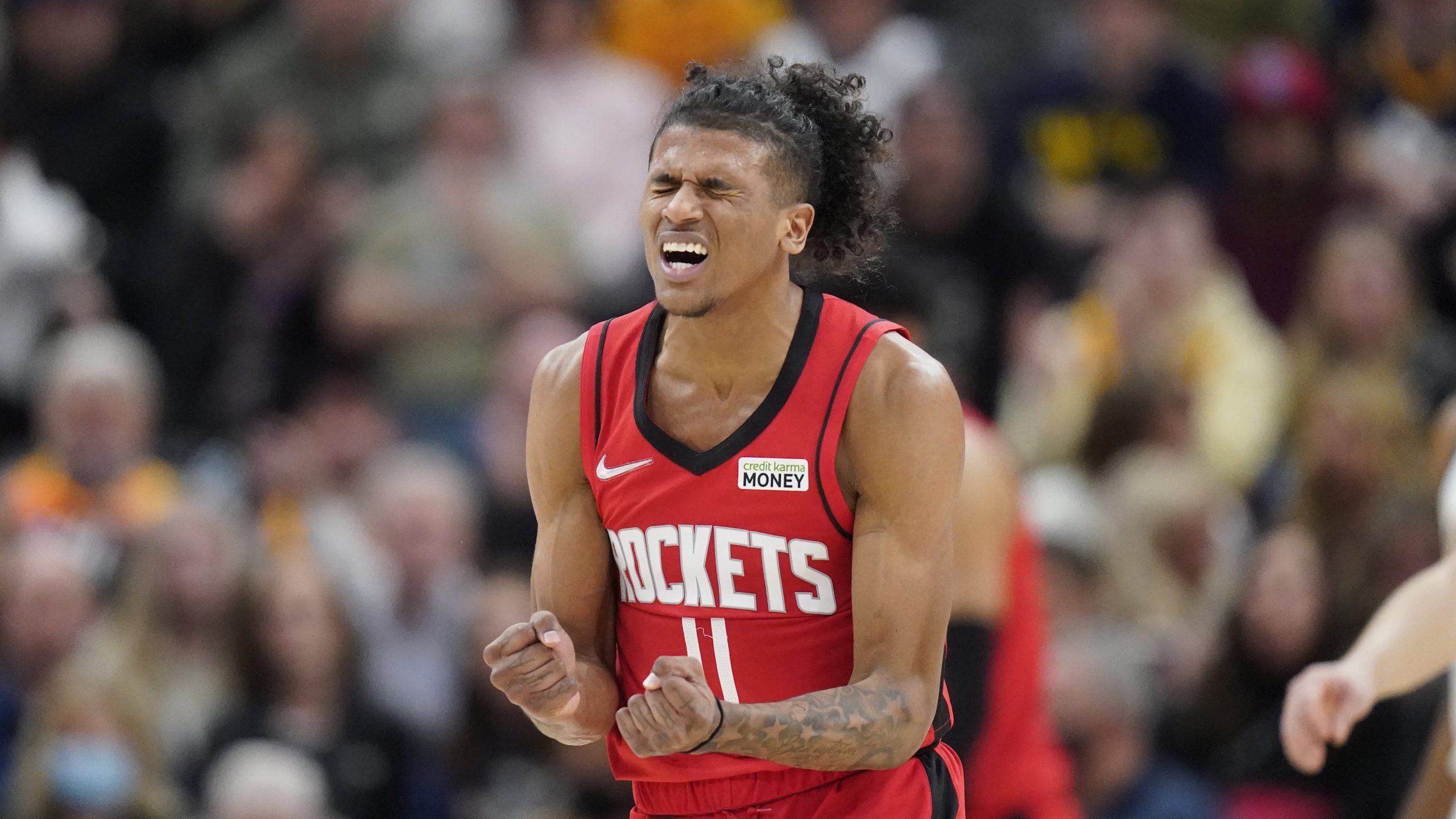 Houston Rockets guard Jalen Green (0) reacts after giving the ball away in the second half during an NBA basketball game against the Utah Jazz Monday, Feb. 14, 2022, in Salt Lake City